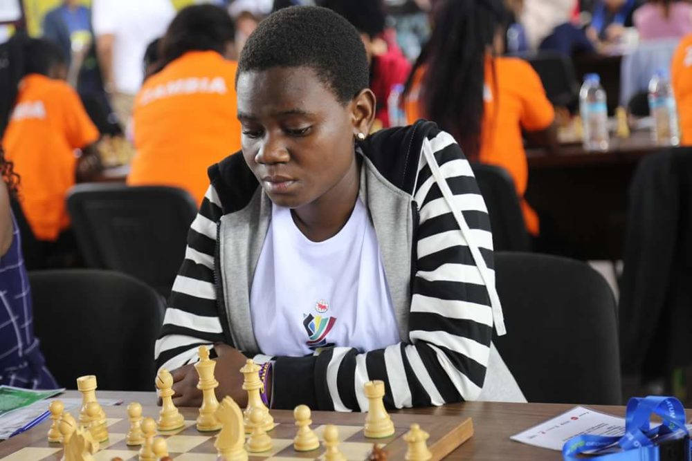 Queen Of Katwe Uganda Playing Chess Wallpaper