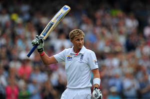 A Focused Joe Root During A Cricket Match Wallpaper