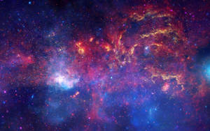 A View Of A Red Nebula Galaxy Littered With Stars Wallpaper