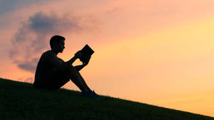 Alone Man Reading Book Wallpaper