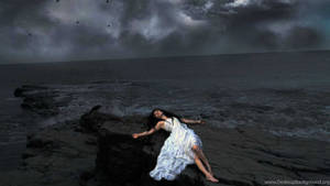 Alone Woman Lying Beside Ocean Wallpaper