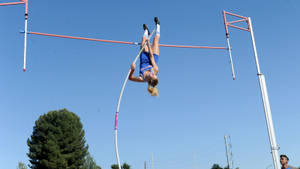 American Pole Vault Athlete Paige Sommers In Action Wallpaper
