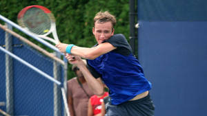 Daniil Medvedev Demonstrates Perfect Backhand During A Tennis Match Wallpaper