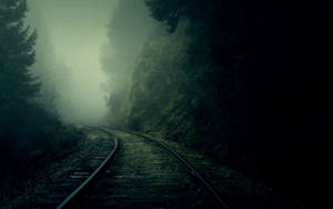 Dark Theme Foggy Forest Railway Wallpaper