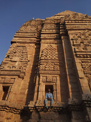 Man Sitting Hindu Temple Wallpaper