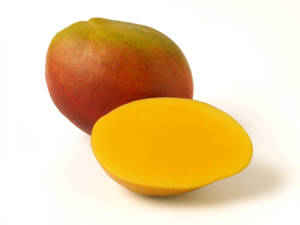 Ripe Mango Fruit On A Wooden Surface Wallpaper