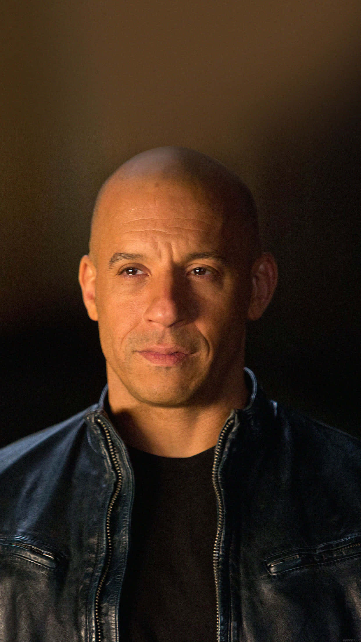 A Bald Man In A Leather Jacket