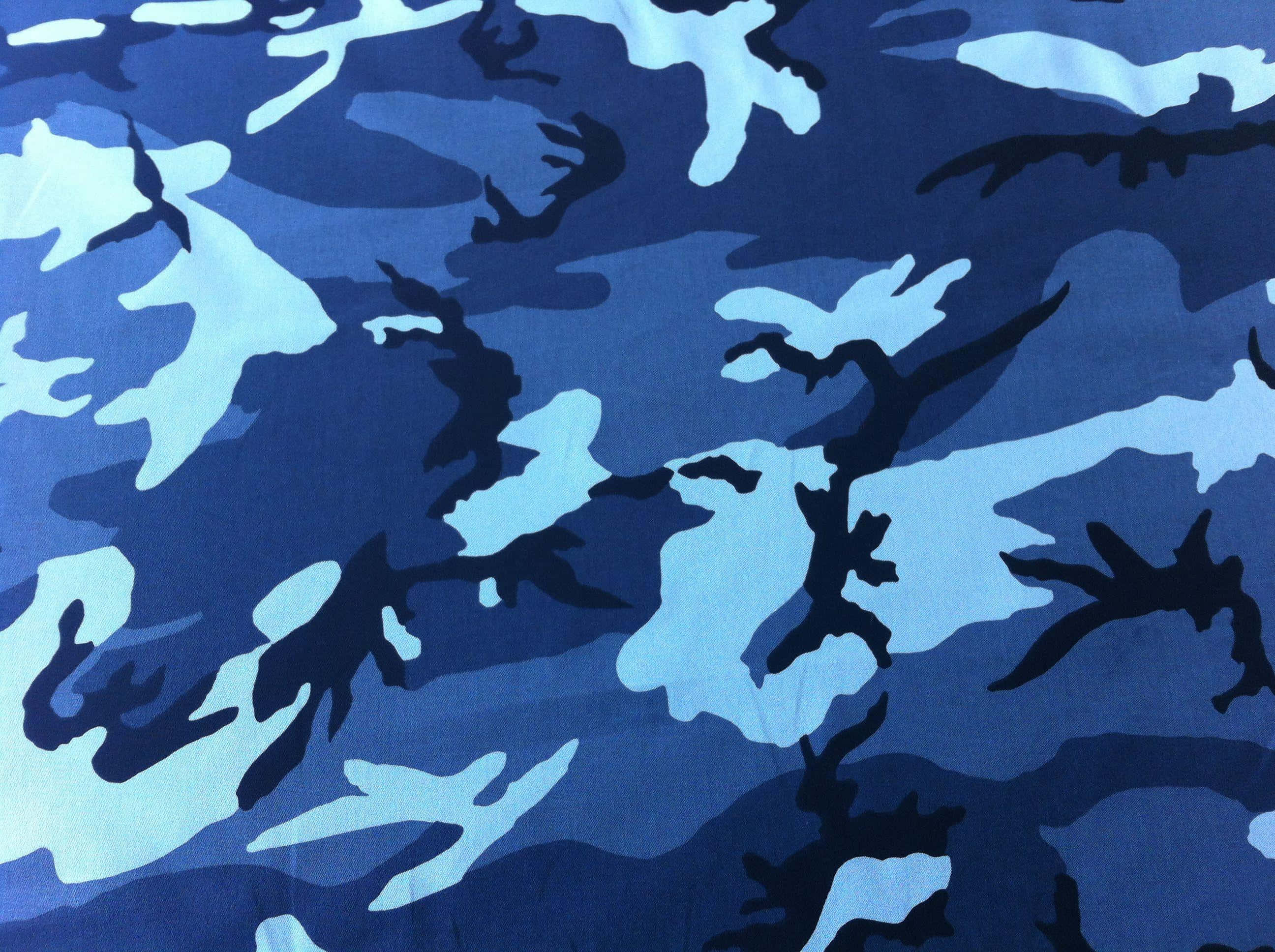 A Blue Camouflage Fabric With Black And Blue Designs