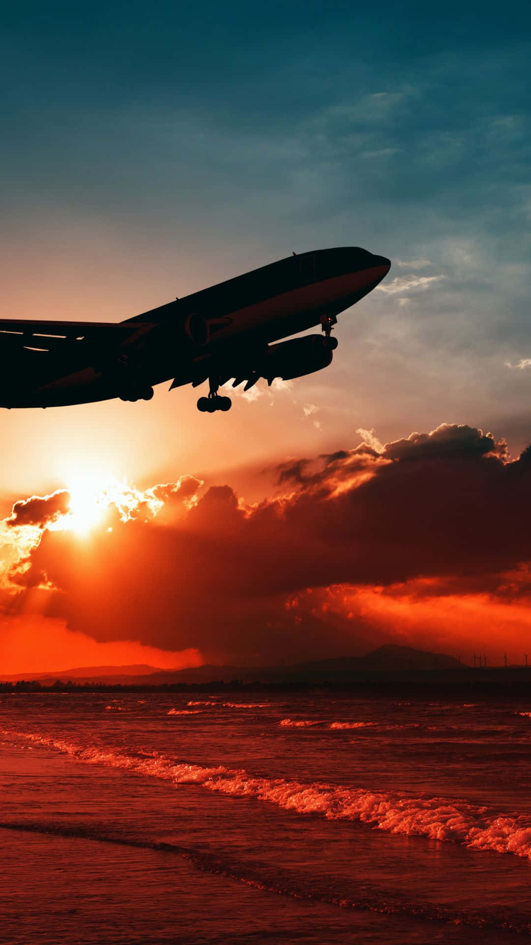A Jet Plane Flying Over The Ocean