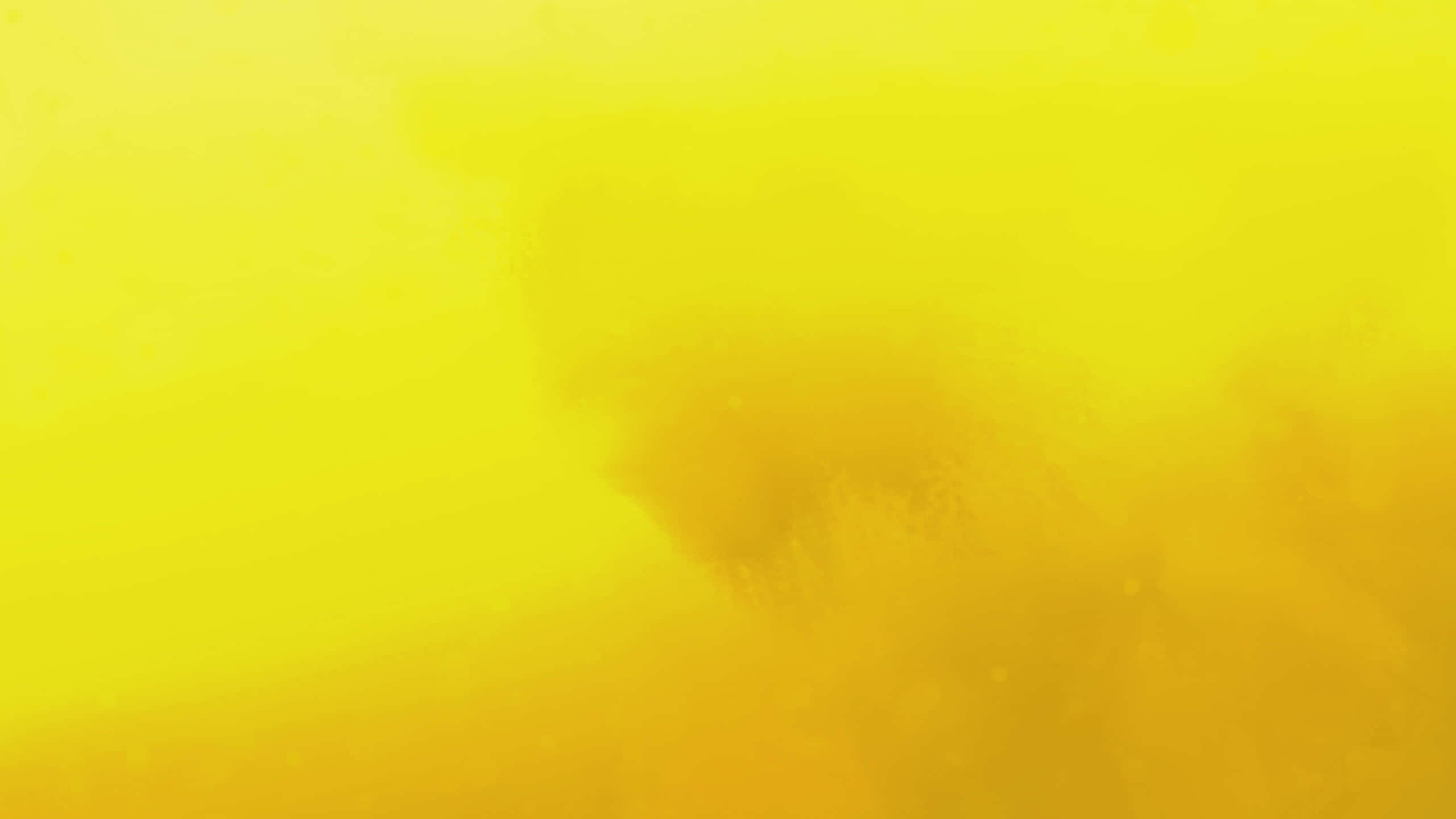 A Pastel Yellow Laptop Sits On A Desk, Ready For Its Next Project