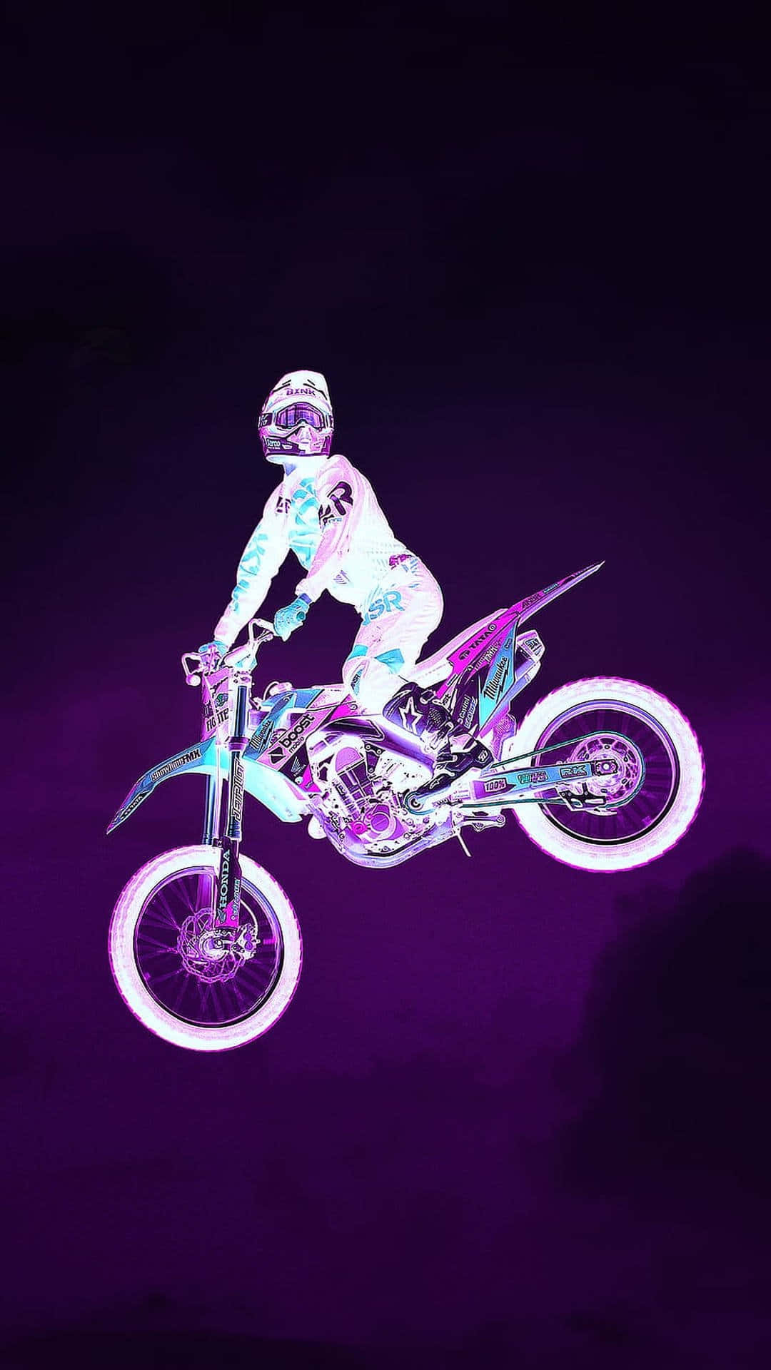 A Person Riding A Dirt Bike In The Air