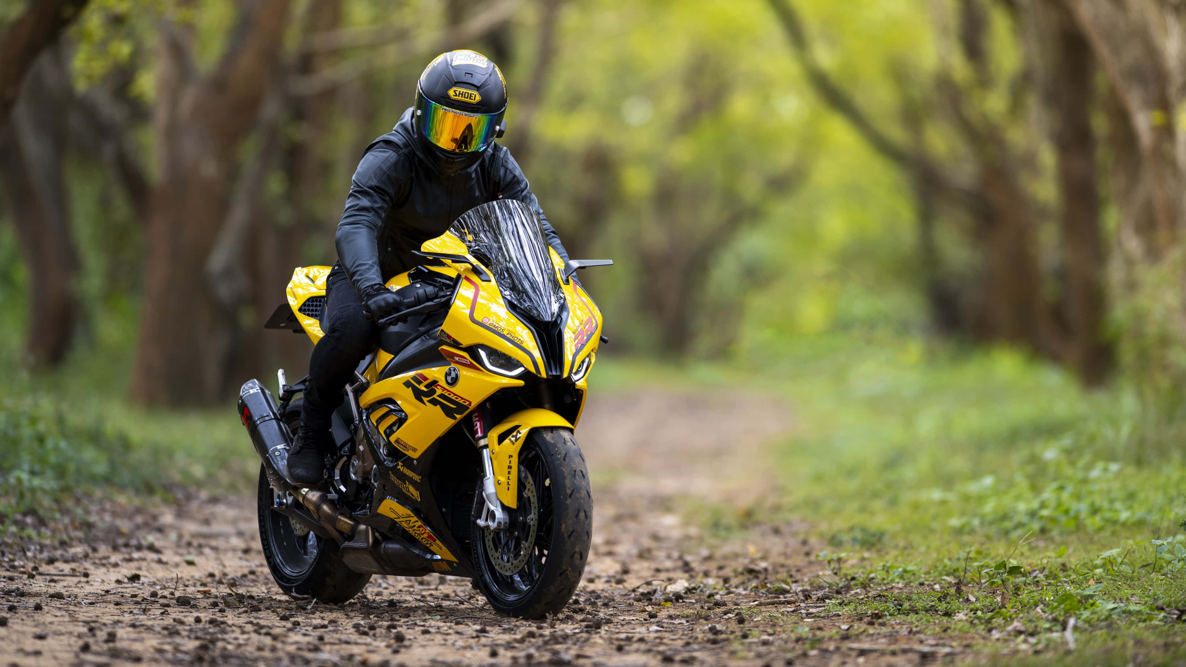 A Person Riding A Yellow Motorcycle
