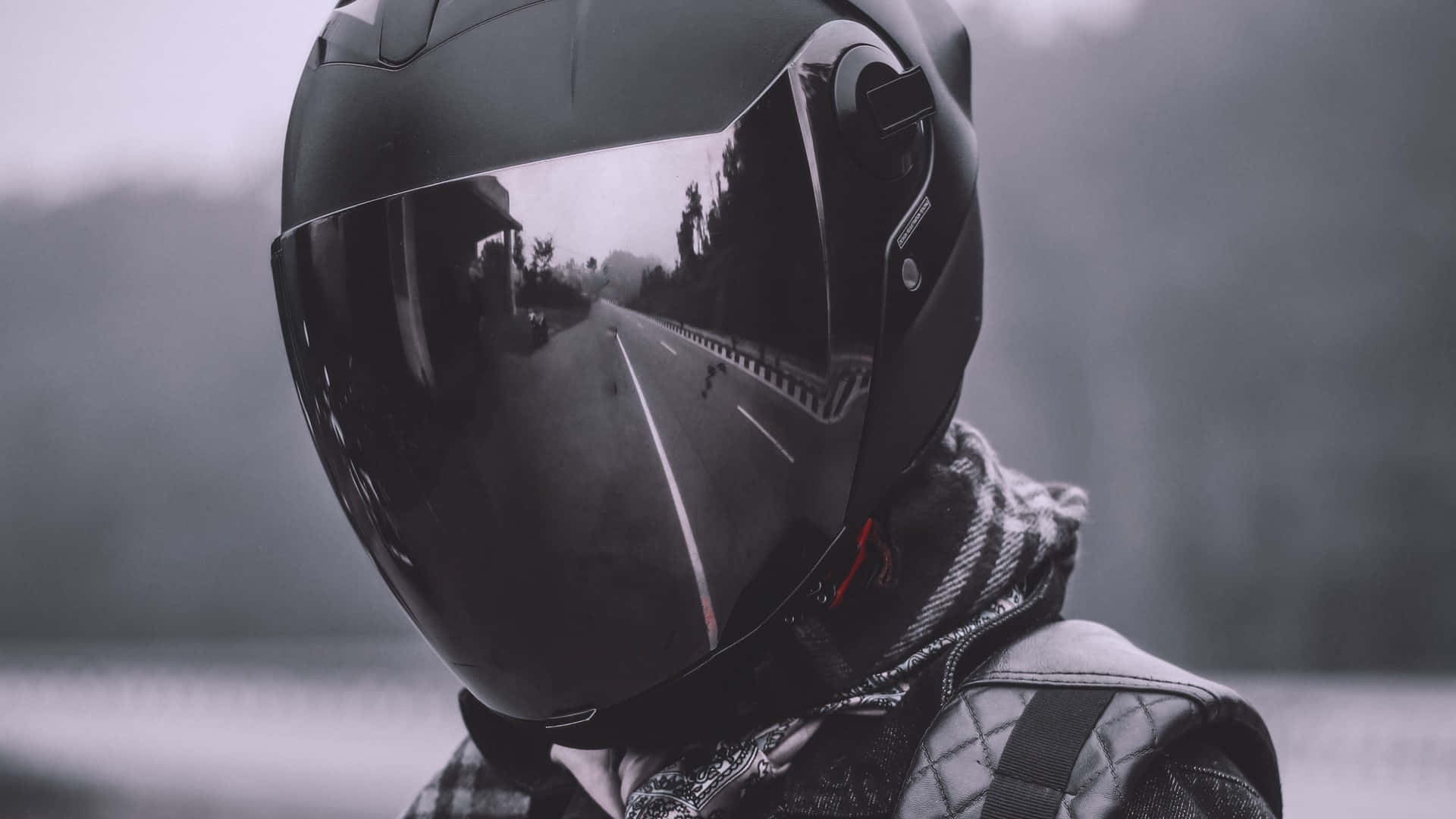 A Person Wearing A Helmet On A Road