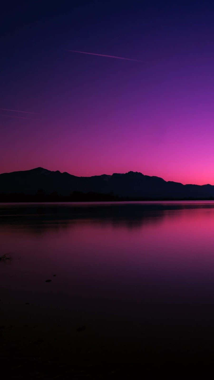 A Purple Sky With Mountains
