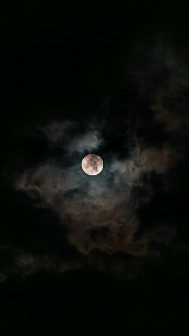 Capture A Piece Of The Night Sky With This Stunning Moon Iphone Wallpaper.