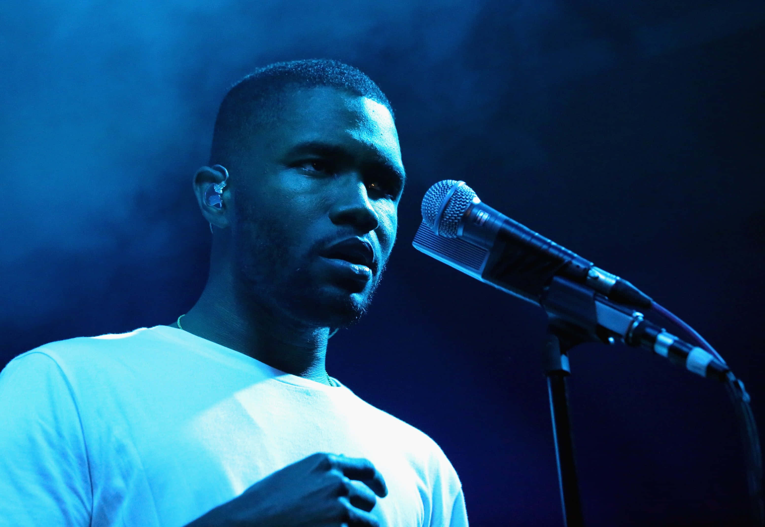 Frank Ocean Surrounded By His Beloved Laptop And Books.