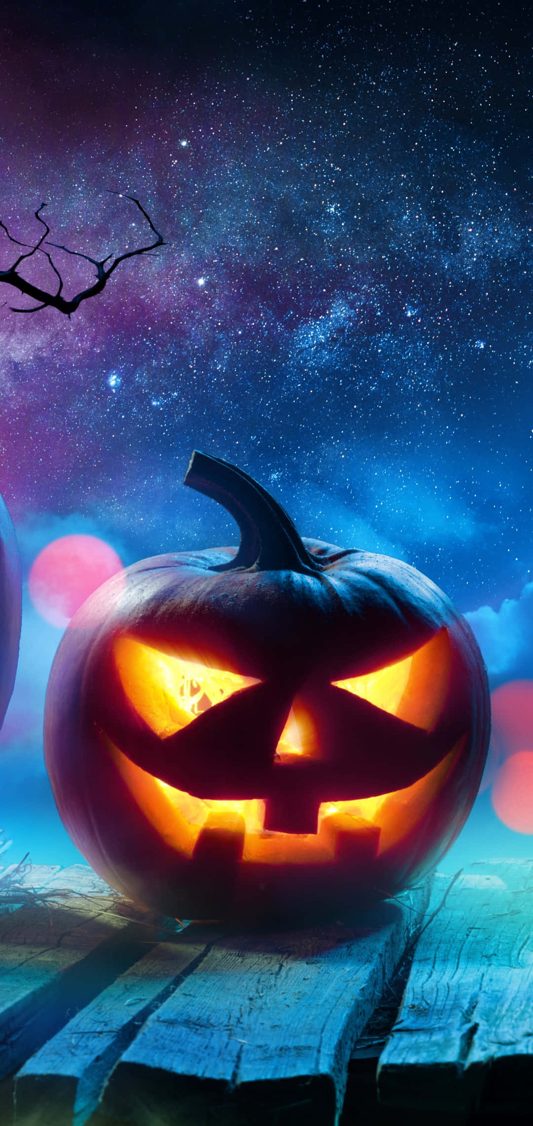 Halloween Pumpkin Glowing Under Starry Sky