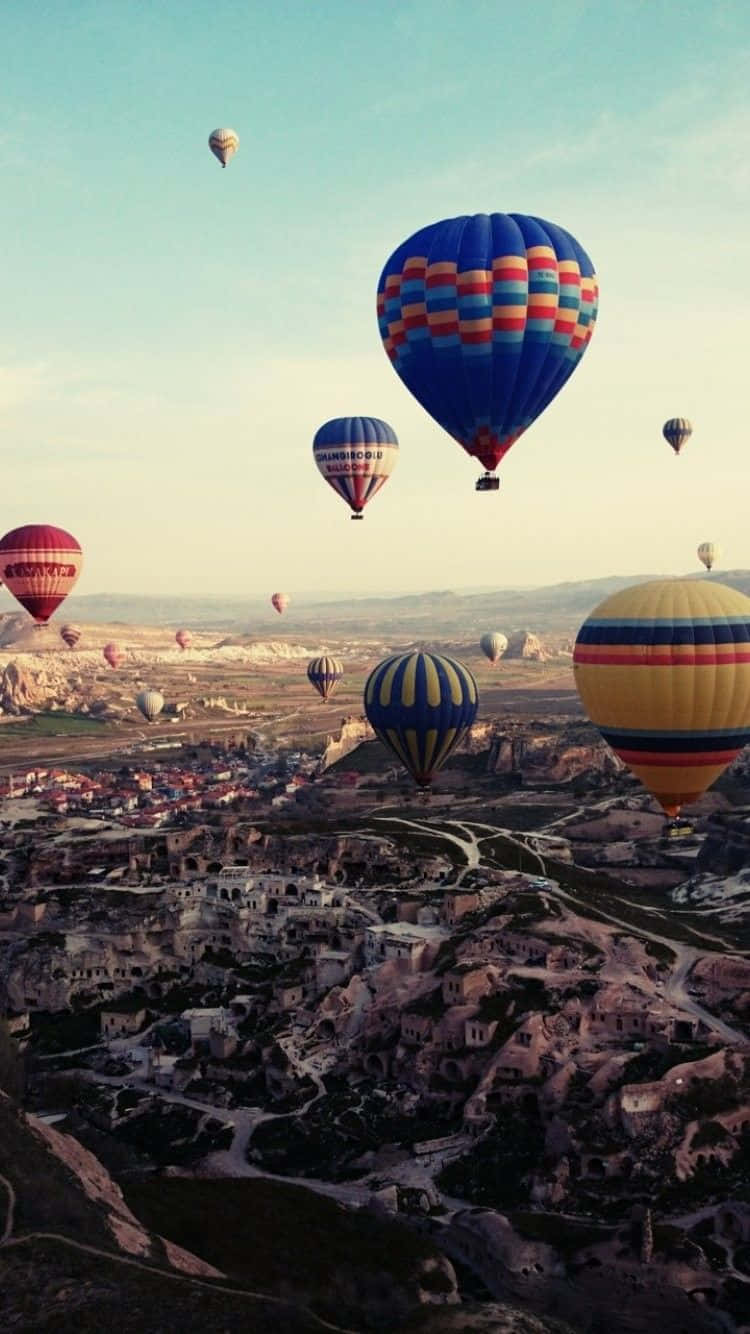 Hot Air Balloons Flying Over A City