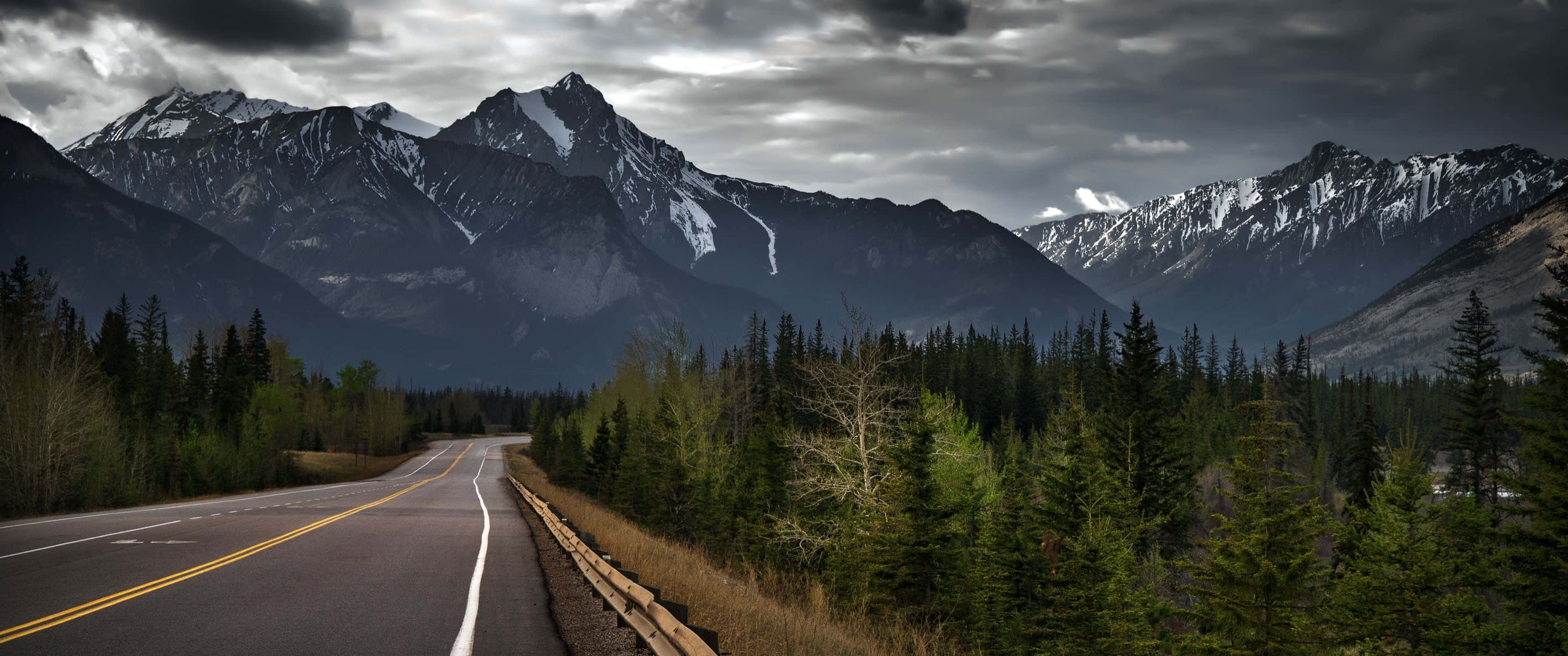 Mountain_ Road_ Under_ Stormy_ Skies