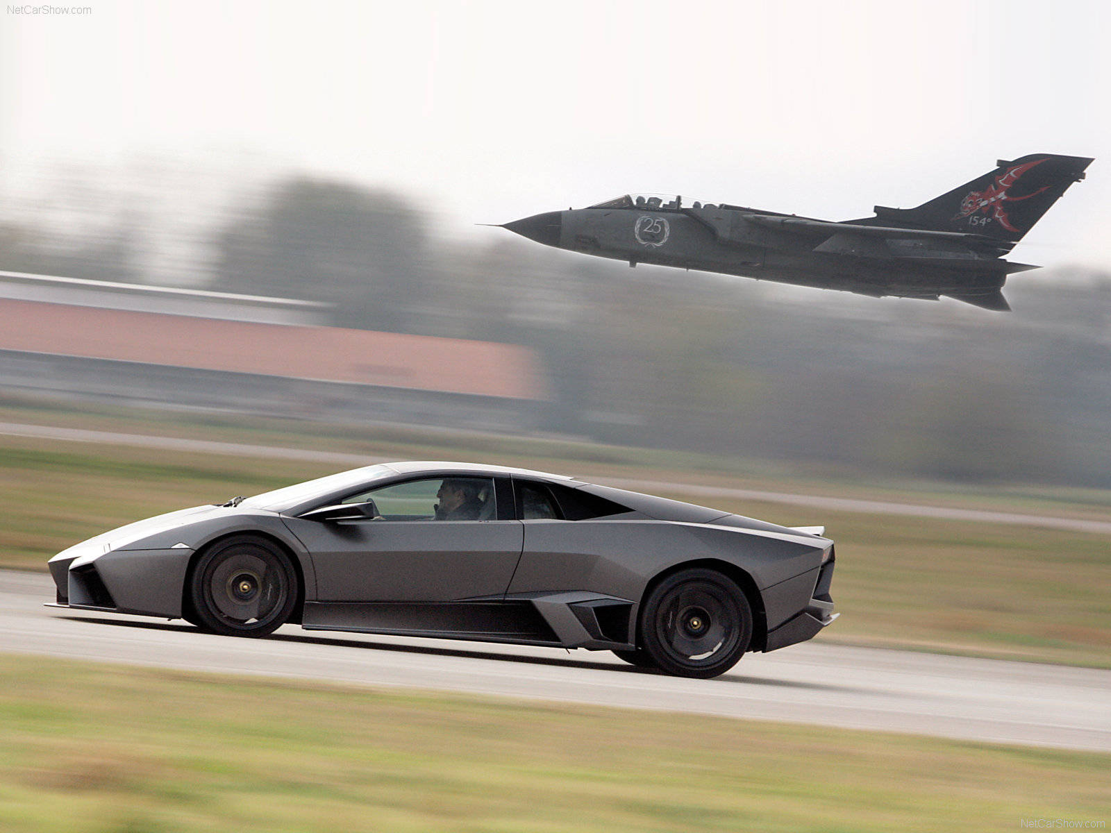 4k Lamborghini Racing With A Jet Wallpaper