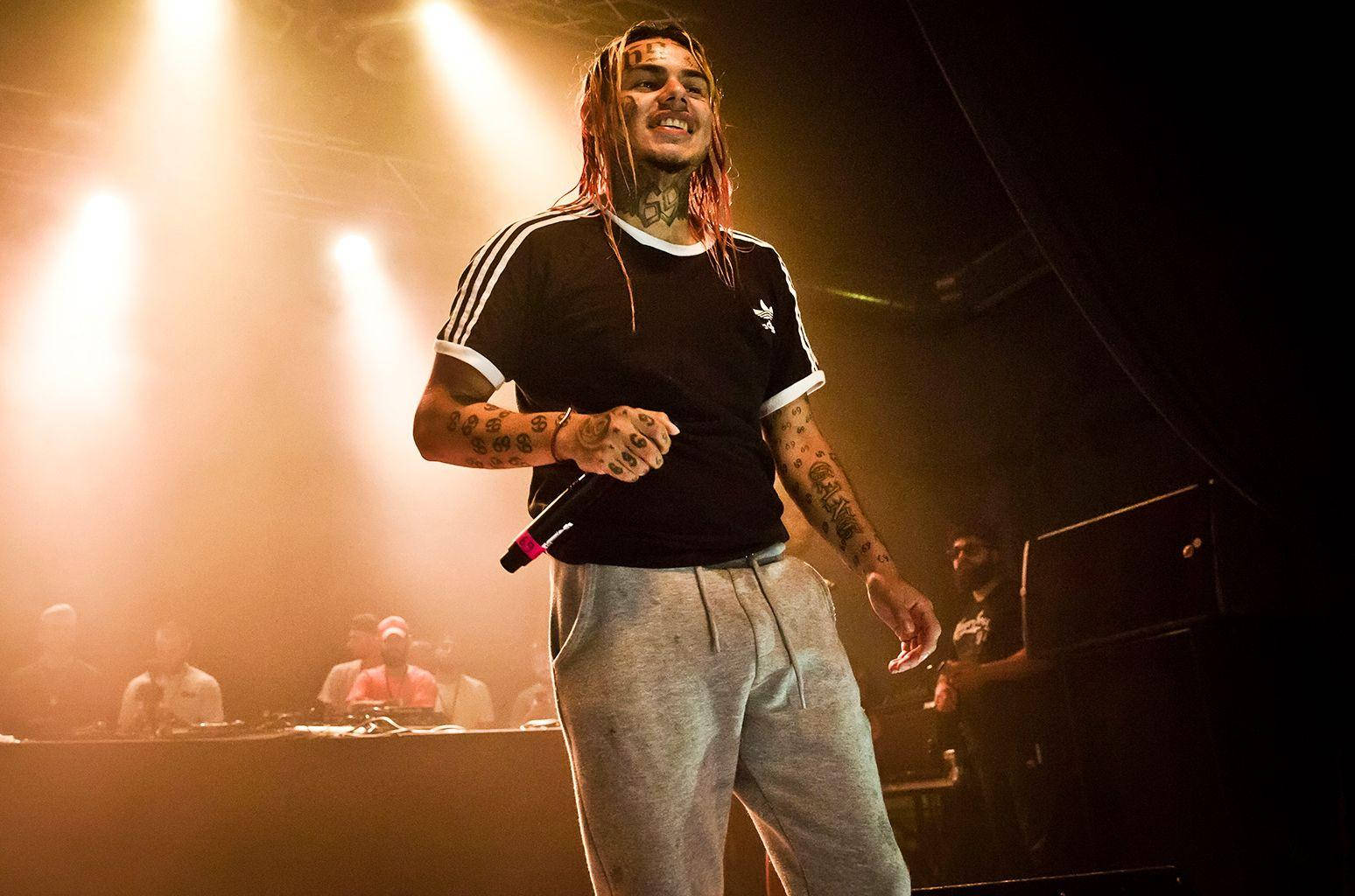 6ix9ine Performing On Stage Wallpaper