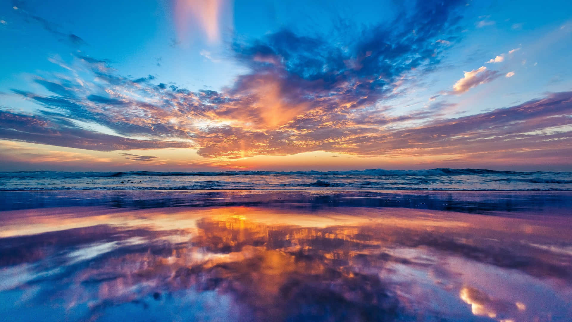 A Beautiful Summer Day At The Beach With A Picturesque Sky Wallpaper