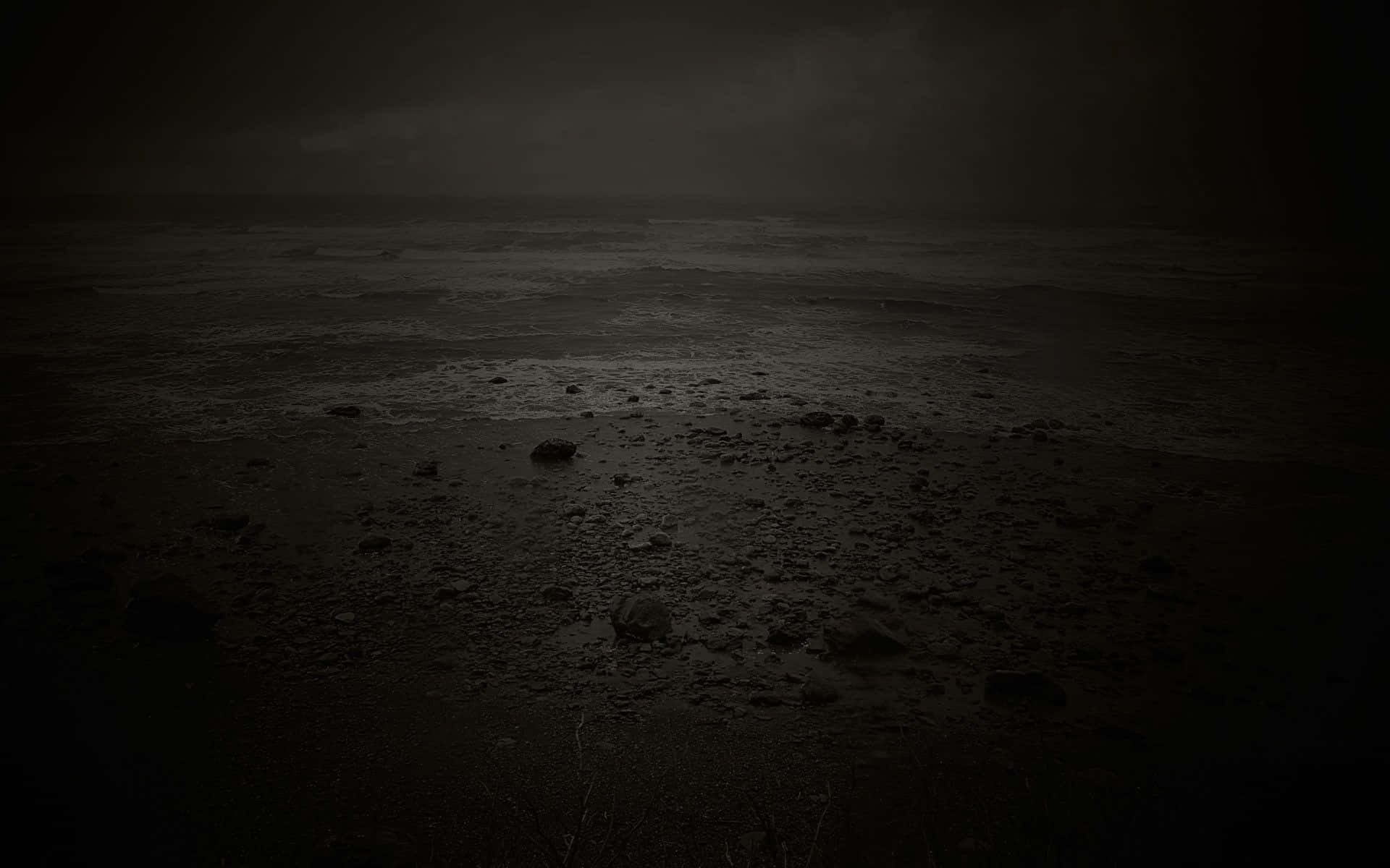 A Black And White Photo Of A Dark Ocean Wallpaper