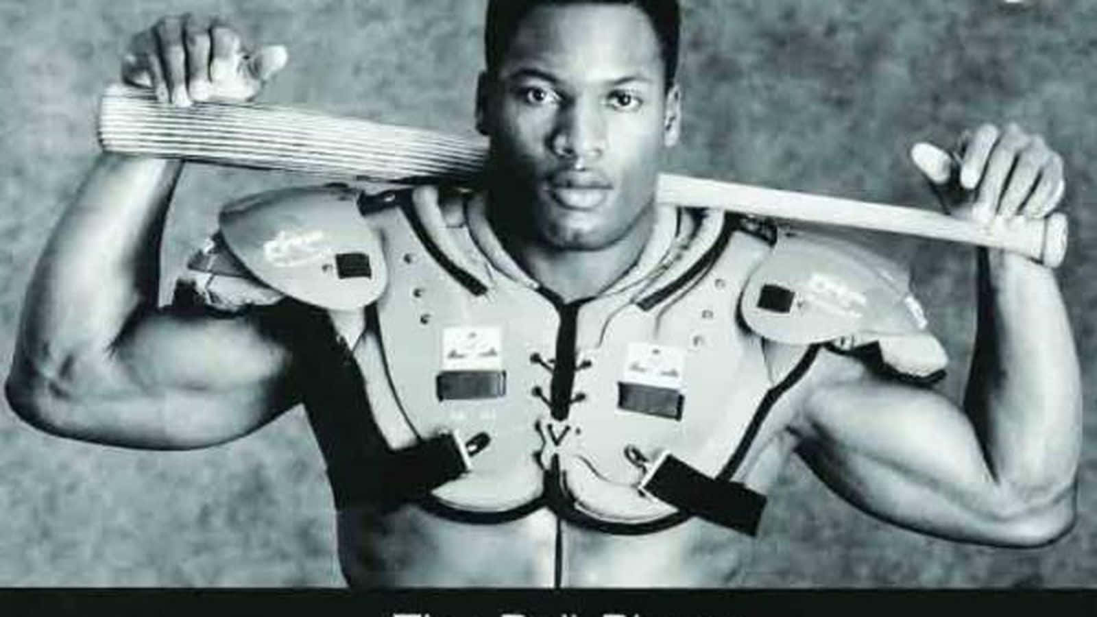 A Black And White Photo Of A Man Holding A Baseball Bat Wallpaper