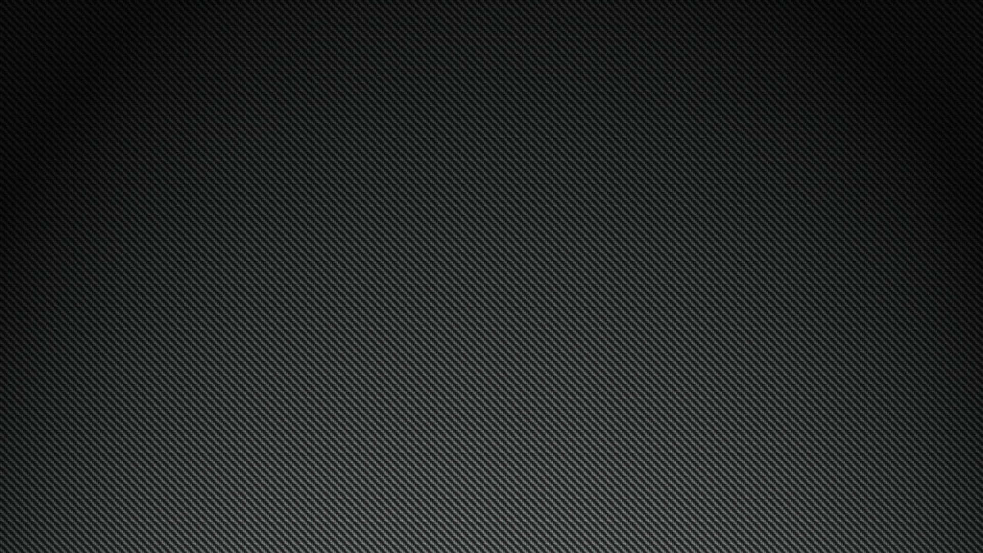 A Black Background With A Light Texture Wallpaper