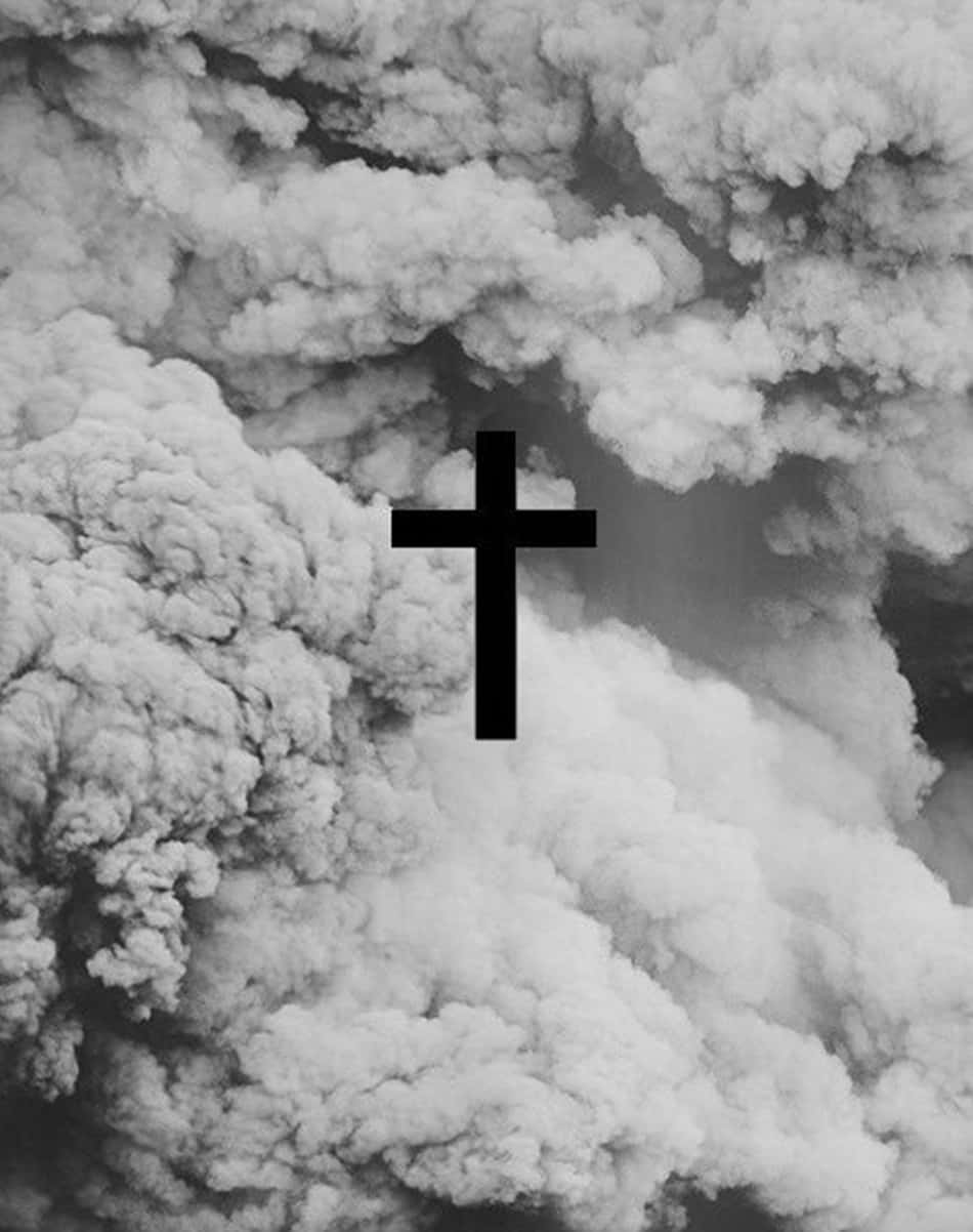 A Black Cross Lone Against A White Sky Wallpaper