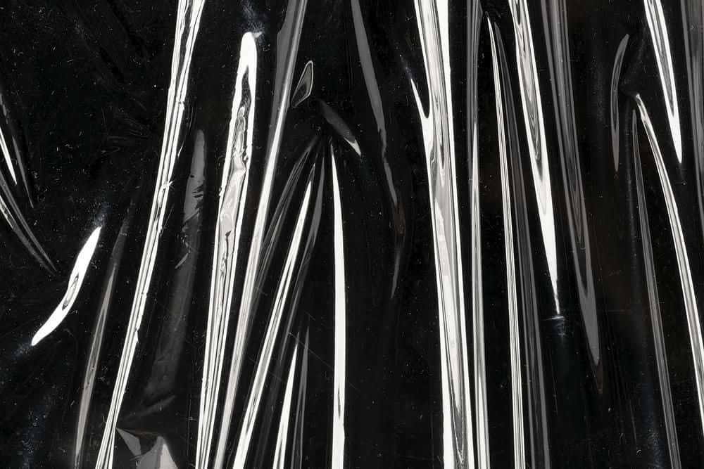 A Black Plastic Bag With A Silver Stripe Wallpaper