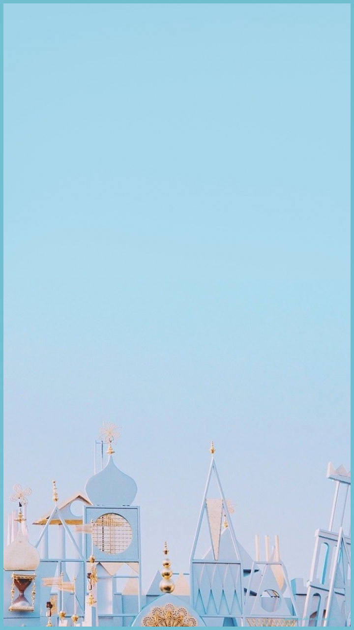 A Blue And White Building With A Blue Sky Wallpaper