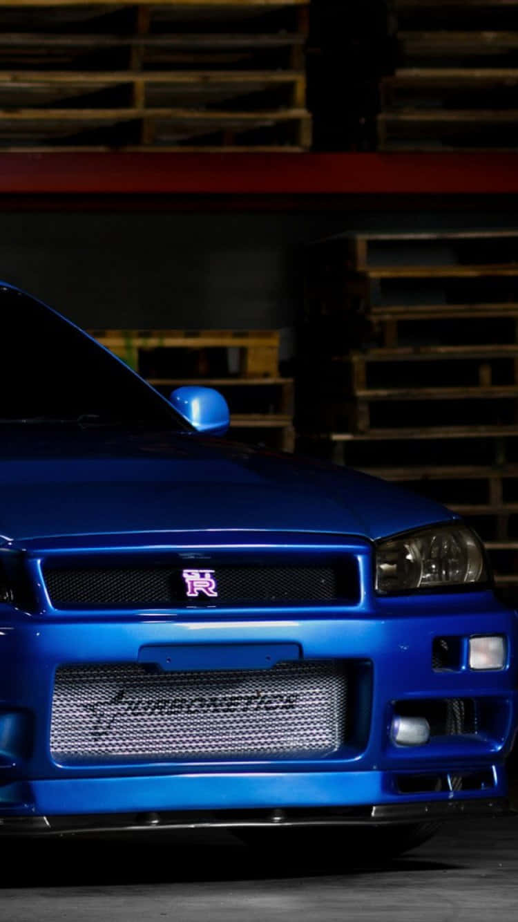 A Blue Car Parked In A Garage Wallpaper