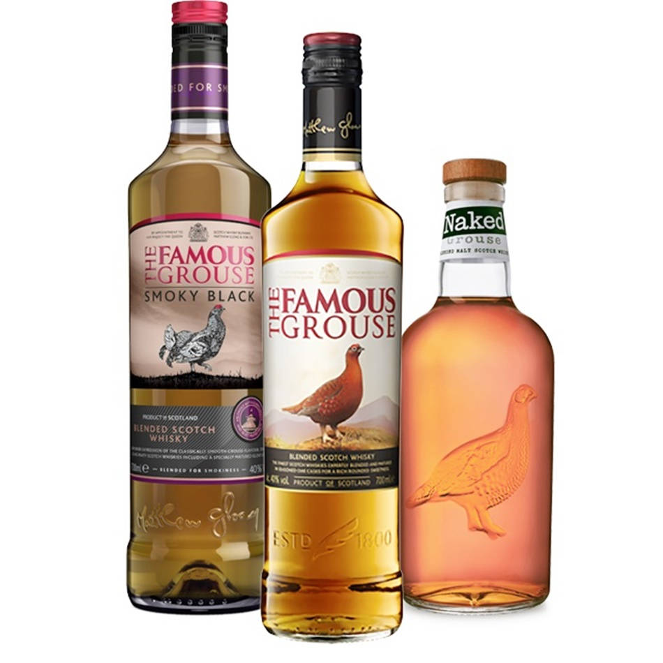 A Bottle Of Famous Grouse Smoky Black Scotch On A Wooden Cask Wallpaper