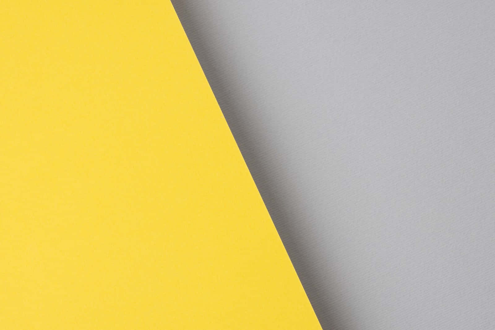 A Bright Gray And Yellow Background Wallpaper