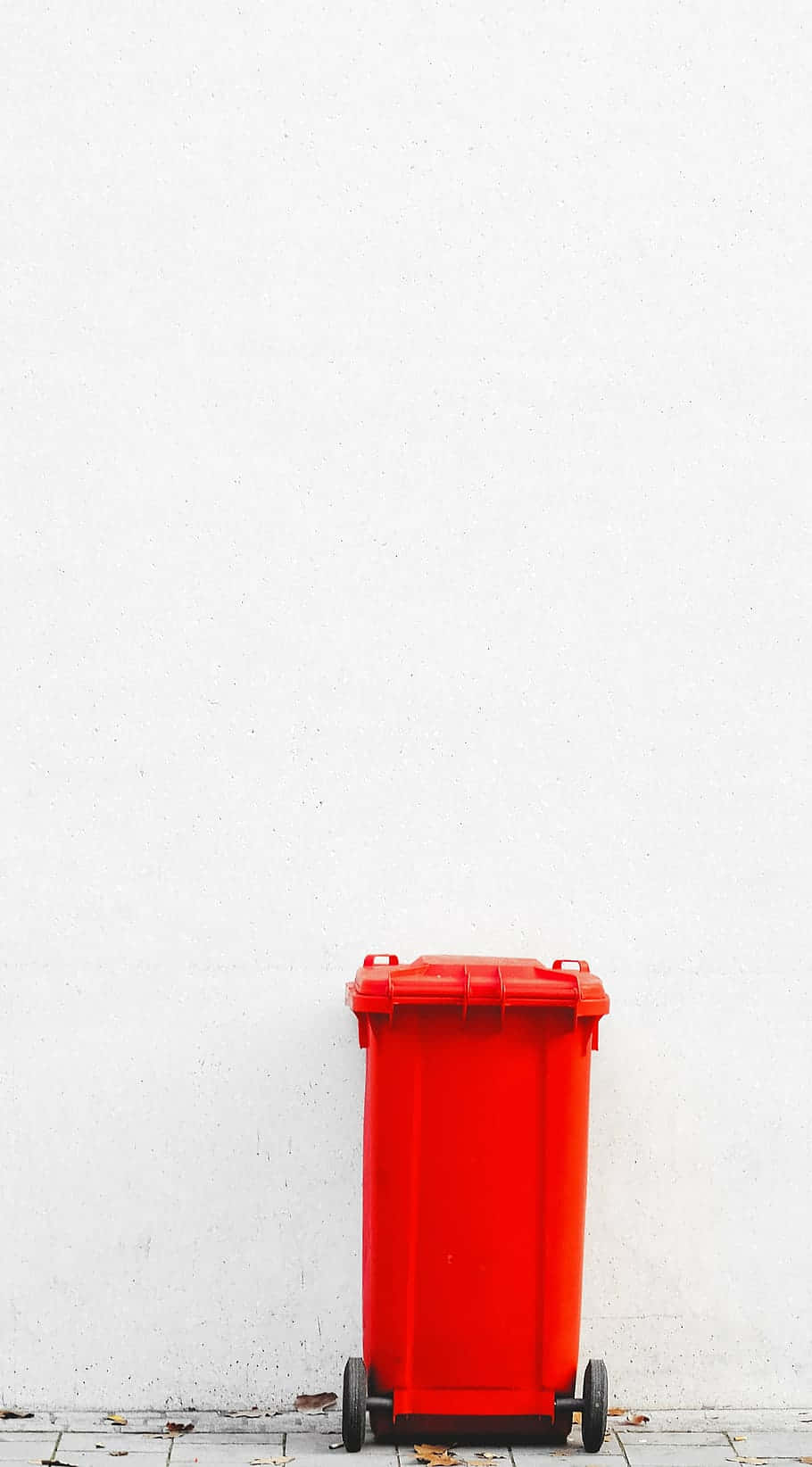 A Bright Red Wheelie Trash Can Wallpaper