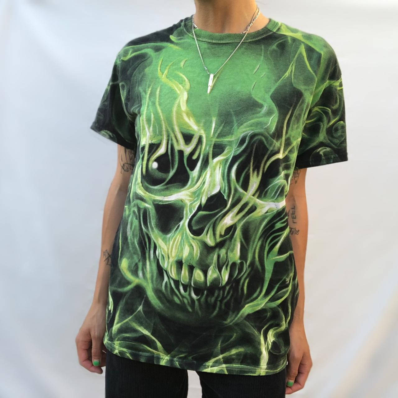 A Burning Green Skull Atop A Menacing Fiery Background Wallpaper