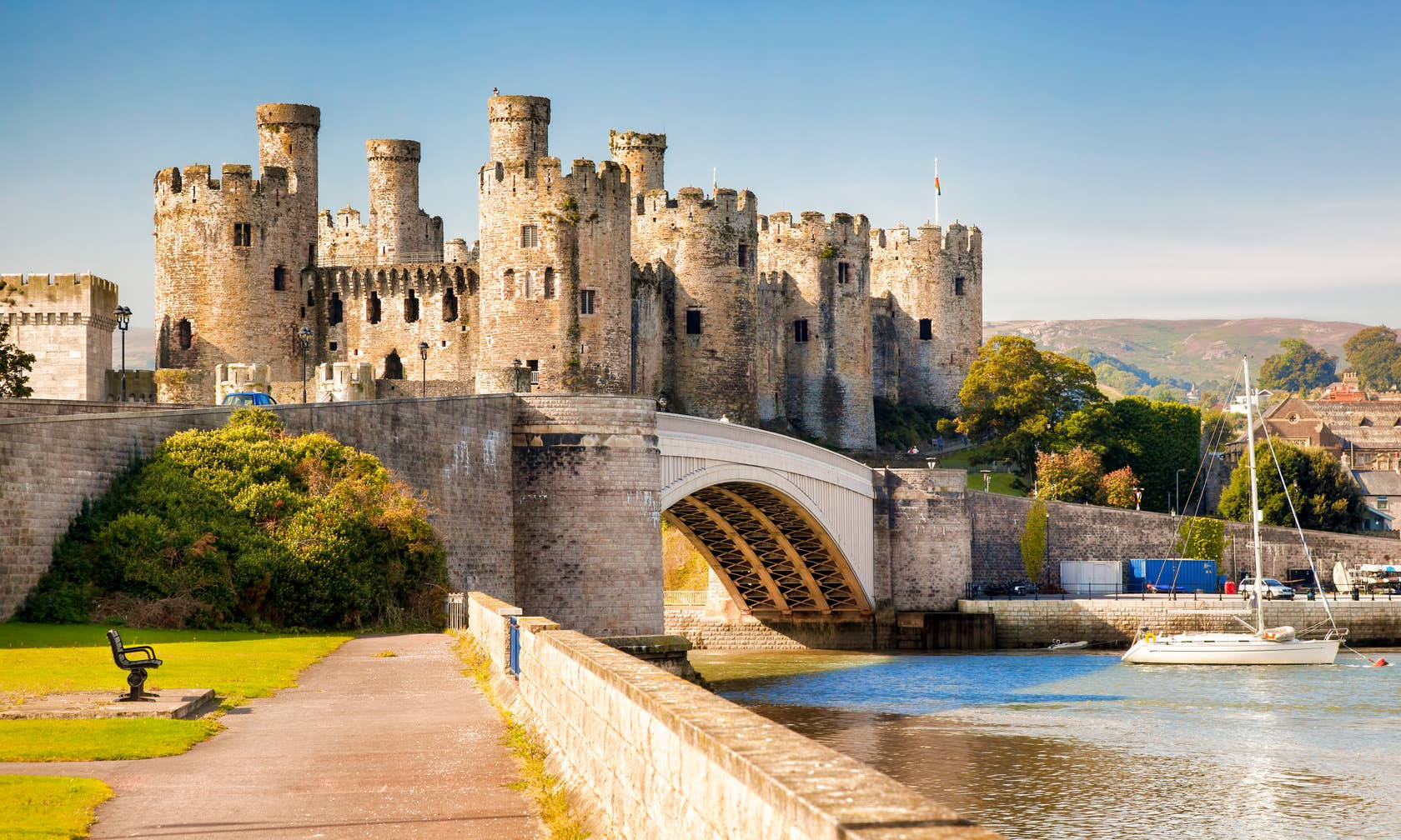 A Castle With Boats On The Water Wallpaper