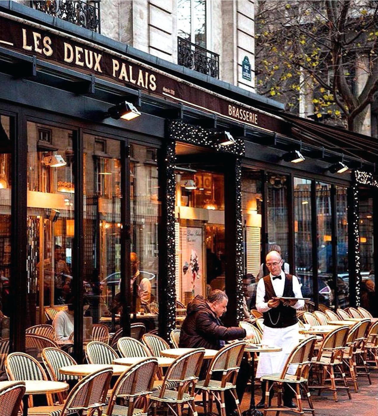A Charming Parisian Café In The Heart Of Paris Wallpaper