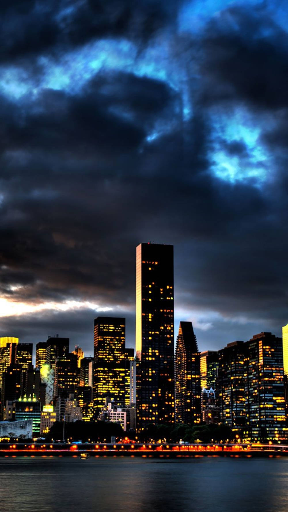 A City Skyline With A Boat Wallpaper