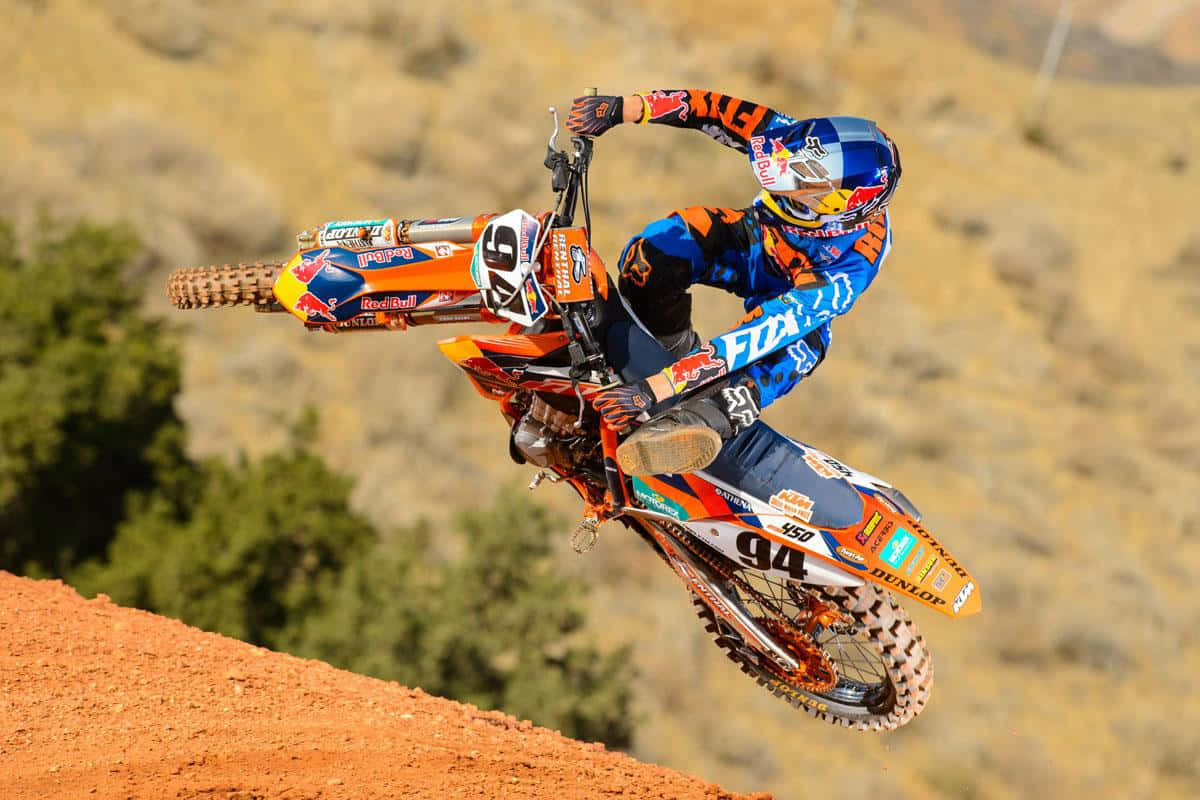 A Dirt Bike Rider In The Air Wallpaper