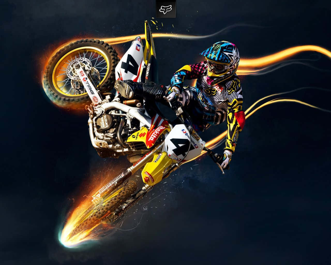 A Dirt Bike Rider Is Flying Through The Air Wallpaper