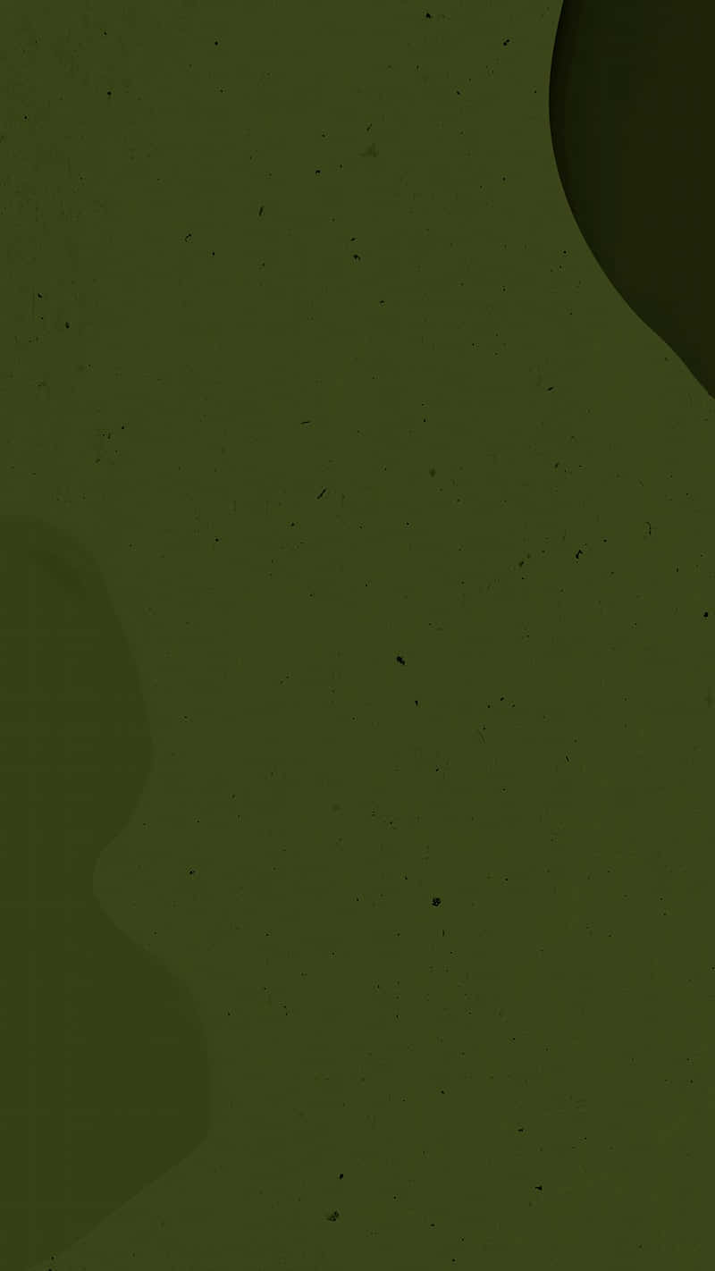 A Green Puddle With A Black Splatter Wallpaper