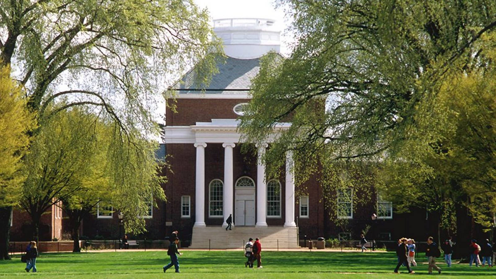 A Group Of Students Strolling Through The Scenic University Of Delaware Campus Wallpaper