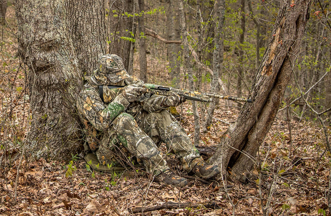 A Hunter Takes Aim During A Turkey Hunt Wallpaper