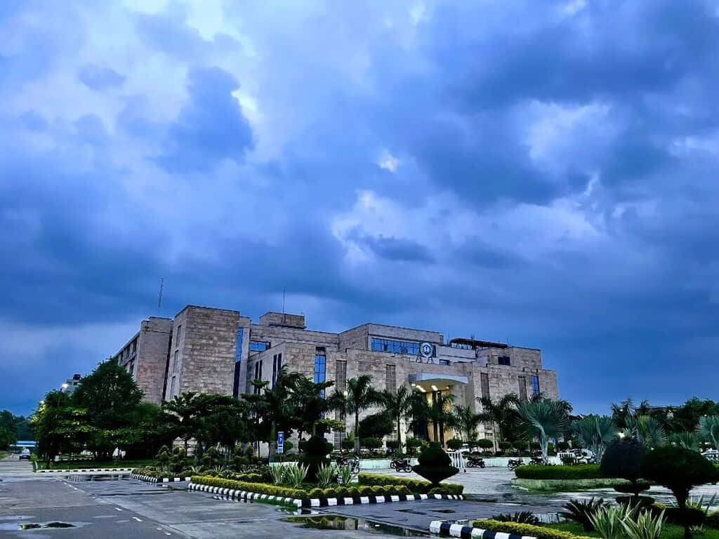 A I I M S Campus Under Stormy Skies Wallpaper