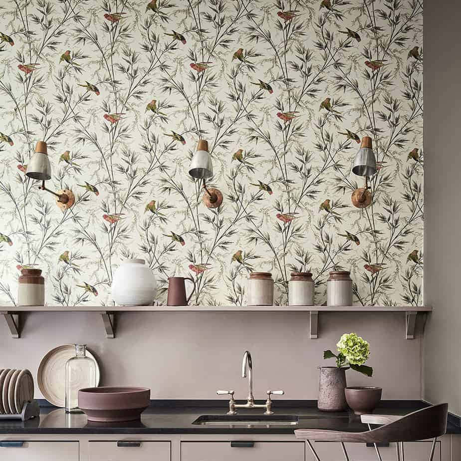 A Kitchen With A White Sink And A Wallpaper Wallpaper