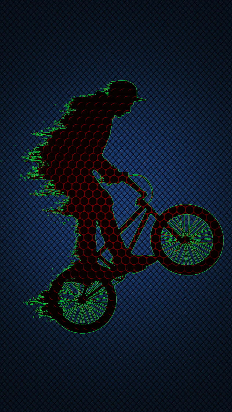 A Man Riding A Bike On A Dark Background Wallpaper