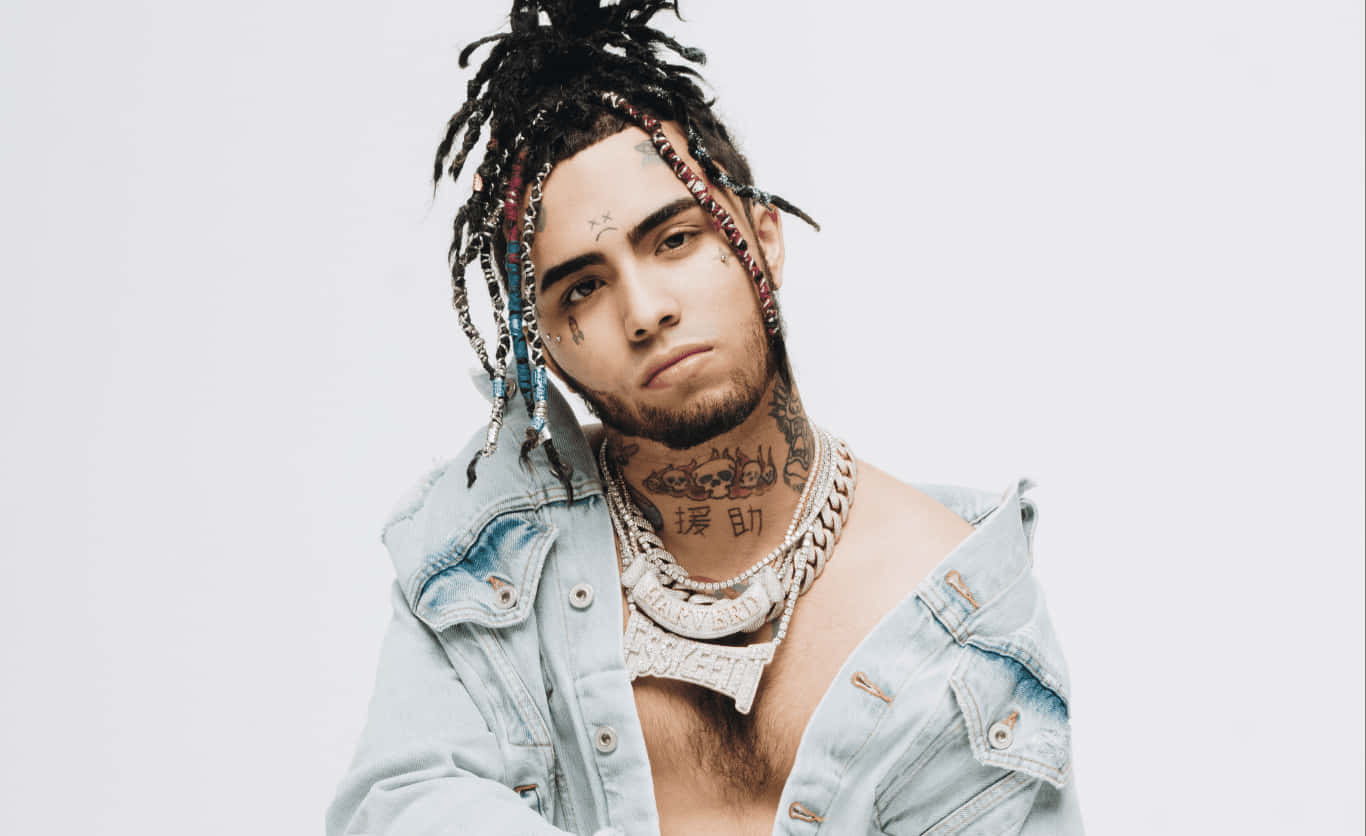 A Man With Dreadlocks And A Necklace Wallpaper