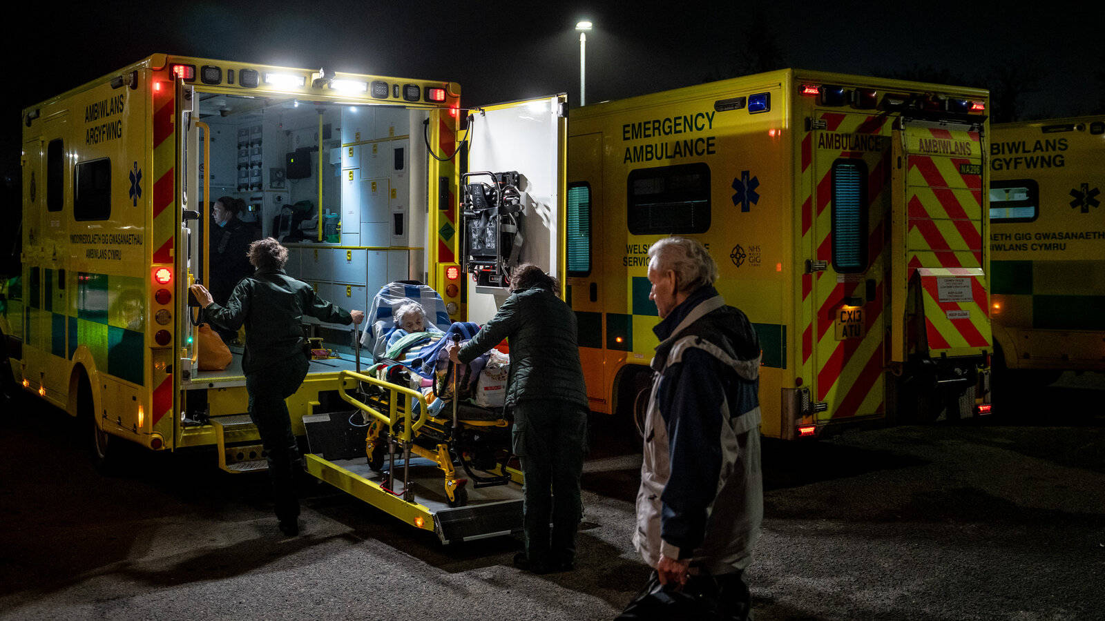 A Paramedic Team Swiftly Responding To An Emergency Wallpaper